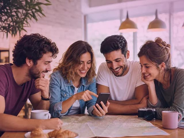 Friends at a table on a plan